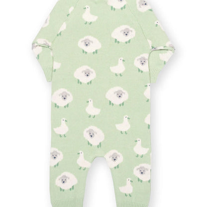 Green baby onesie with white floral and duck pattern on a white background