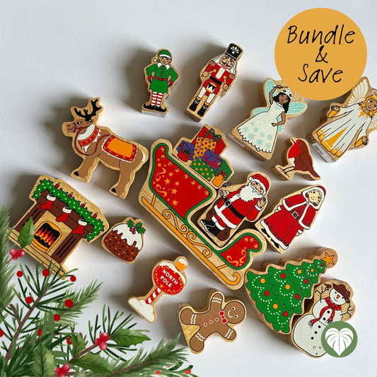 A collection of hand-painted wooden Christmas-themed figurines and ornaments arranged on a white background, including Santa Claus, a reindeer, a Christmas tree, a gingerbread man, a snowman, a fireplace, a nutcracker, and an angel. A yellow circle in the top right reads 'Bundle & Save'.
