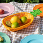 Pineapple-shaped woven fruit basket with food-safe plastic and metal frame
