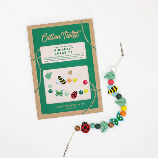 Make-your-own mini-beast bracelet kit with packaging on a white background