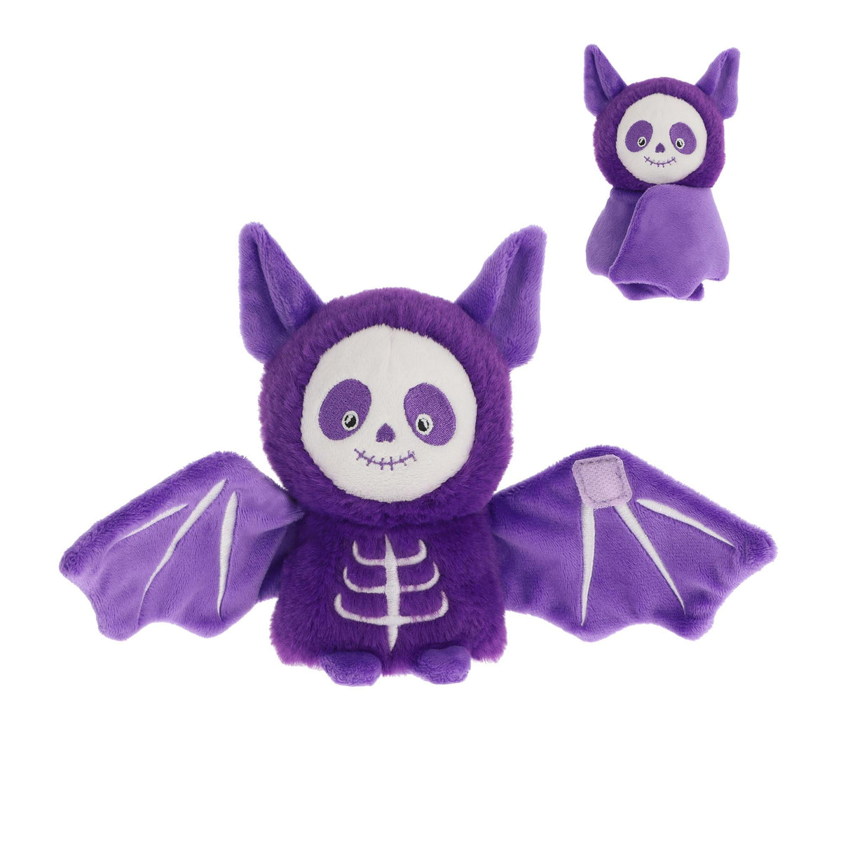 Purple bat-shaped plush toy with skeleton design on a white background