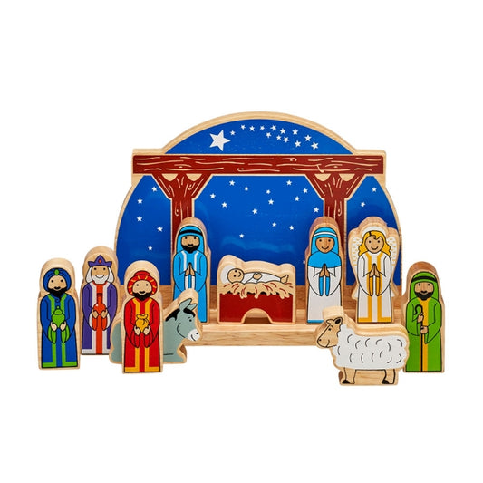 A wooden Christmas nativity set with colorful painted figures of Mary, Joseph, baby Jesus, three wise men, a shepherd, a donkey, and a sheep, arranged under a blue starry sky backdrop on a white background.