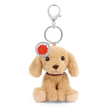 Plush dog keychain with a tag on a white background