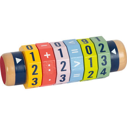 A wooden toy math wheel with colorful segments showing numbers and basic arithmetic symbols, photographed on a plain white background.